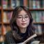 91大神学员在职学习者小慧头像，年轻女性，专注学习状态，背景为图书馆